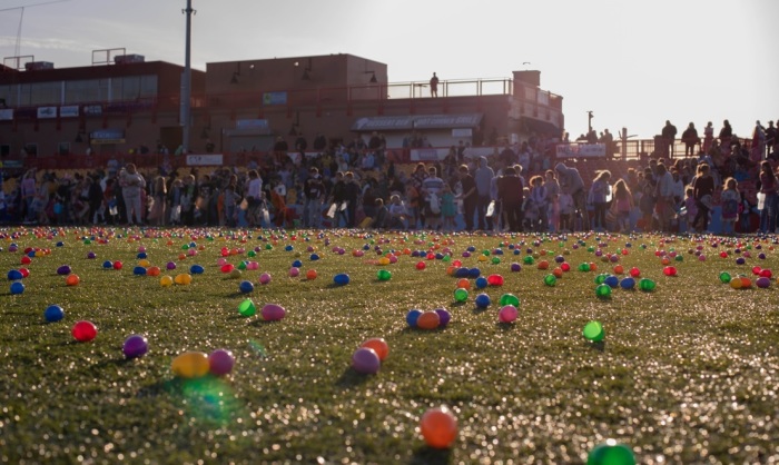 Children are seen at one of multiple Easter Egg Drop events hosted by 7 Hills Church on Easter Sunday, April 17, 2022. Approximately 200,000 Easter eggs were dropped and over 3,000 children participated in the event. 