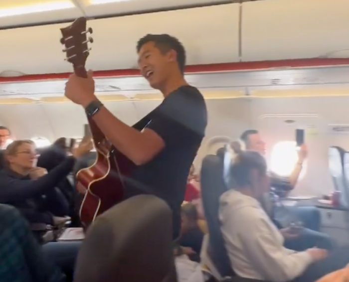 Passengers on an EasyJet flight out of Poland sing a Christian worship song in April 2022.