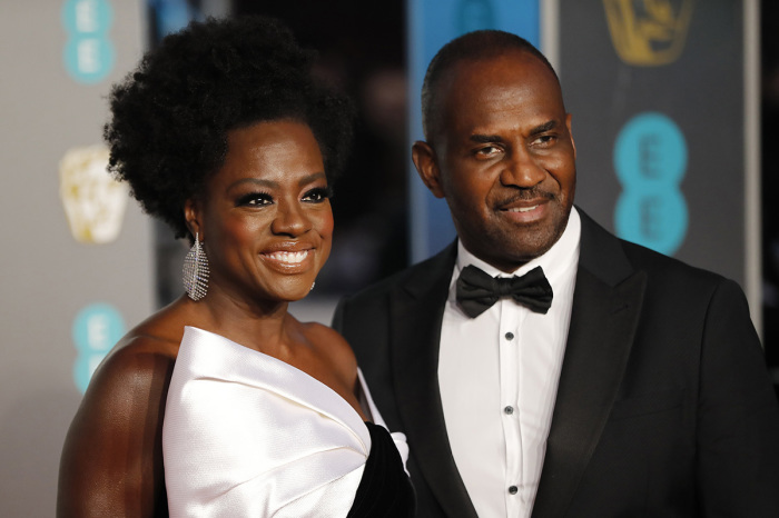 Actress Viola Davis (L) and her husband, actor Julius Tennon (R), pose on the red carpet upon arrival at the BAFTA British Academy Film Awards at the Royal Albert Hall in London on February 10, 2019.