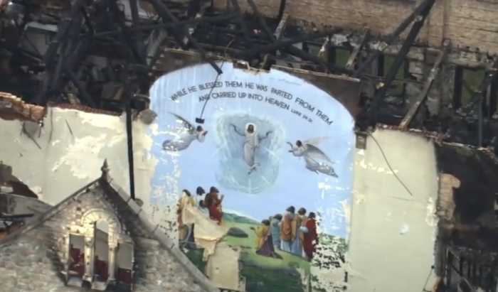 A mural depicting Christ's resurrection remains standing after fires broke out in the Antioch Missionary Baptist Church in Chicago, Illinois, on April 19, 2022.