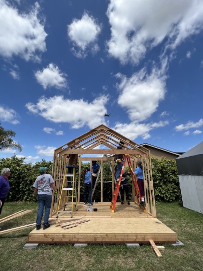 A group of volunteers helps build a cabin for the homeless on Meridian Baptist Church property in El Cajon, California. 