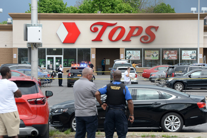 Buffalo Police on scene at a Tops Friendly Market on May 14, 2022, in Buffalo, New York. At least 10 people were killed after a mass shooting at the store with the shooter in police custody.
