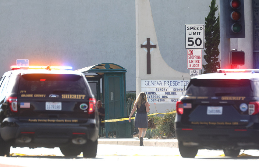 Police vehicles are parked near the scene of a shooting at the Geneva Presbyterian Church on May 15, 2022, in Laguna Woods, California. According to police, the shooting left one person dead, four critically wounded, and one with minor injuries.