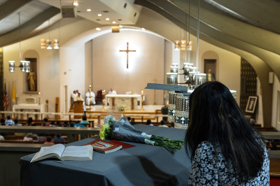 A mourner attends a vigil at Sacred Heart Catholic Church for victims of a mass shooting at Robb Elementary School on May 24, 2022, in Uvalde, Texas. According to reports, 19 students and two adults were killed before the gunman was fatally shot by law enforcement. 
