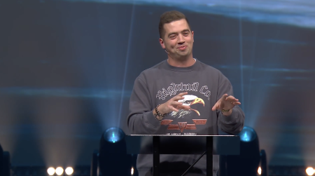 Young adult ministry leader JD Rodgers of Texas’ Watermark Community Church preaches a sermon to young adults on June 1, 2022.