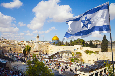 Israeli flag with a view of the Old City of Jerusalem and the Western Wall. 