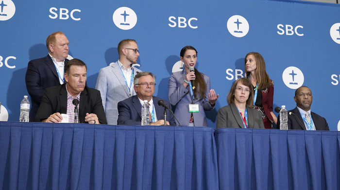 Sexual abuse survivor and survivor advocate Rachael Denhollander, holding microphone, answers a question during a press conference following the adoption of the recommendations from the SBC’s Sexual Abuse Task Force Tuesday, June 14 during the 2022 SBC Annual Meeting in Anaheim. 