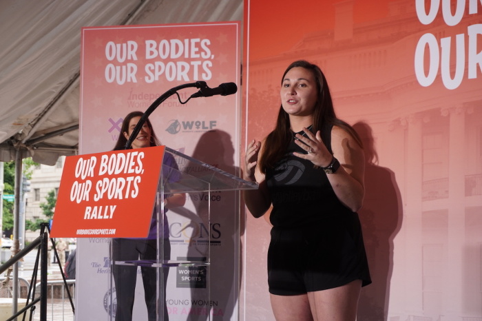 A female athlete speaks at the 'Our Body, Our Sports' rally in support of protecting women's sports from male competitors who identify as female in Washington, D.C., June 23, 2022.