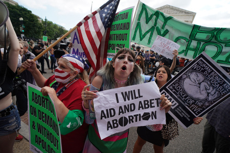 Pro-choice and anti-abortion demonstrators gather outside the U.S. Supreme Court in Washington, D.C., on June 24, 2022.