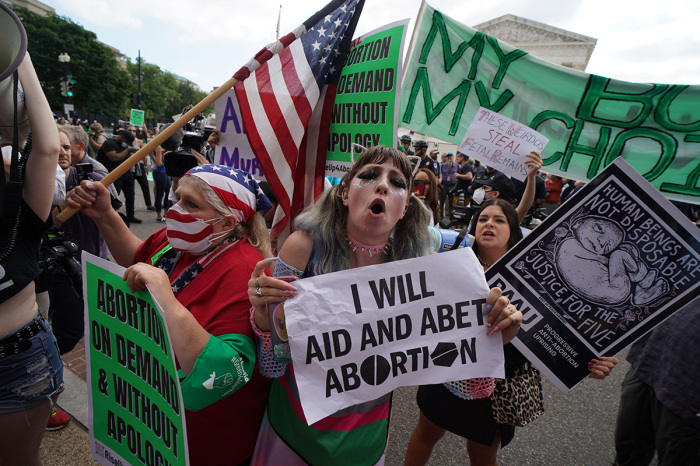 Pro-choice and anti-abortion demonstrators gather outside the U.S. Supreme Court in Washington, D.C., on June 24, 2022. 