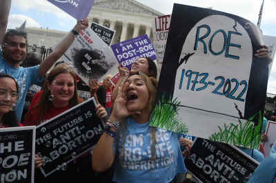 Anti-abortion campaigners celebrate outside the US Supreme Court in Washington, DC, June 24, 2022. - The US Supreme Court on Friday ended the nationwide legalization of abortion in one of the most divisive and hotly contested issues in American political life.  Court overturns Roe v.  Wade