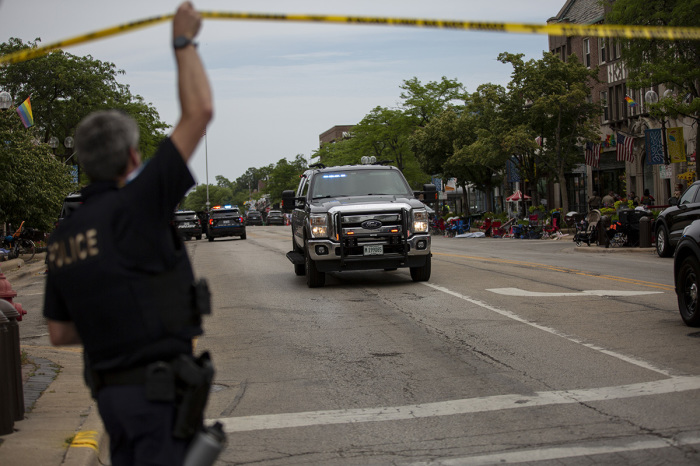 First responders work the scene of a shooting at a Fourth of July parade on July 4, 2022, in Highland Park, Illinois. Reports indicate at least six people were killed and 24 injured in the mass shooting. 