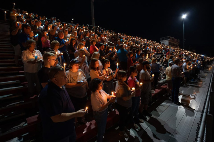Members of the community gather at Prestonsburg High School stadium for a candlelight vigil in memory of the officers. A few Billy Graham Rapid Response Team chaplains also attended the vigil.