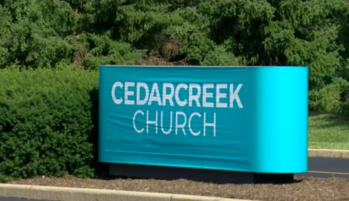 A sign sits outside the entrance to Cedar Creek Church in Perrysburg, Ohio.
