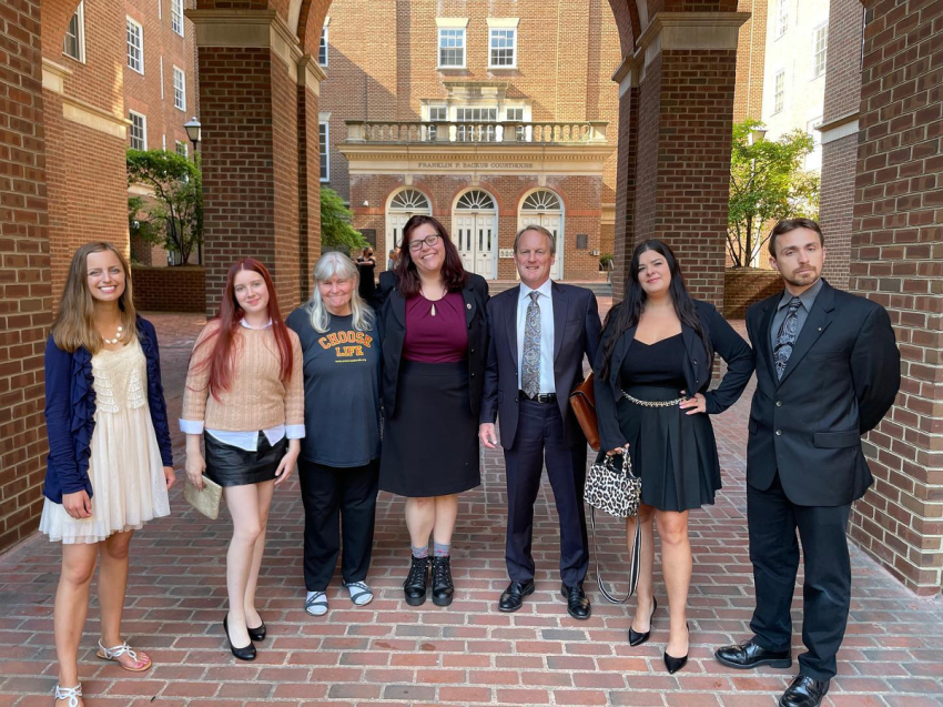 Pro-life activists Cassidy Shooltz, Kristin Turner, Joan Andrews Bell, Lauren Handy, Terrisa Bukovinac and Jonathan Darnel are pictured with their lawyer outside the Alexandria Circuit Court in Alexandria, Virginia, ahead of their sentencing for "trespassing" at an abortion facility on July 12, 2022.