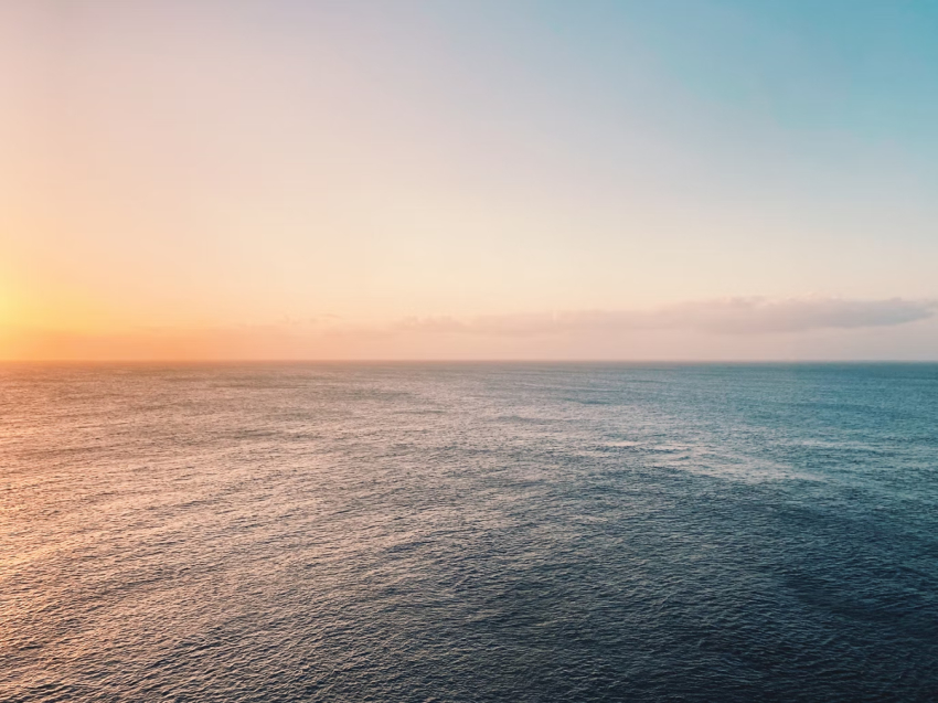 The Gulf of Mexico shimmers at sunset.