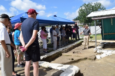 Descendants of members of First Baptist Church of Williamsburg, Virginia, one of the first black congregations in America, listen to information about an excavation at the site of the early 19th century church on July 18, 2022.