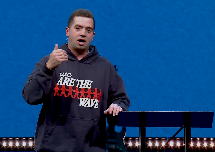 Young adult pastor JD Rodgers from Watermark Community Church preaching a sermon on July 26, 2022.