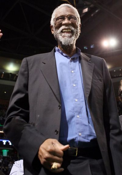 Former Boston Celtic Bill Russell waves to the cheering fans in the first quarter as the Boston Celtics take on the Detroit Pistons on February 15, 2012 at TD Garden in Boston, Massachusetts