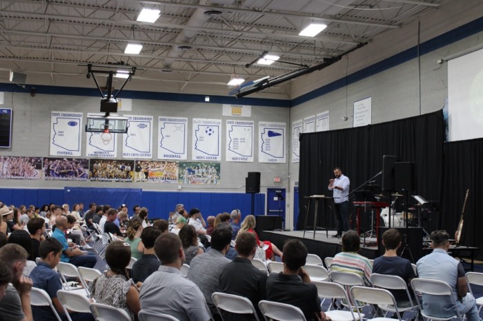 Costi Hinn (right) preaches a message on Ephesians to his congregation in the Valley Christian High School Gym in July 2022. 