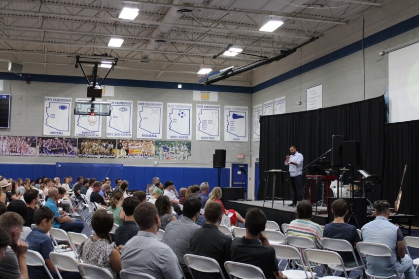 Costi Hinn (right) preaches a message on Ephesians to his congregation in the Valley Christian High School Gym in July 2022.