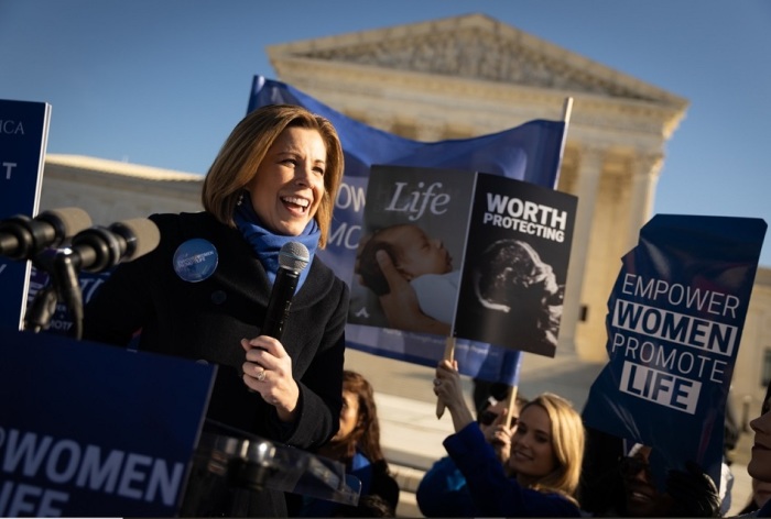 Kristen Waggoner of the Alliance Defending Freedom speaks outside of the United States Supreme Court during oral arguments in the case of Dobbs v. Jackson on Dec. 1, 2021. 