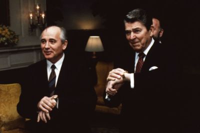 Ronald Reagan, the 40th President of the United States (right), and Soviet leader Mikhail Gorbachev (left) synchronize their watches. 