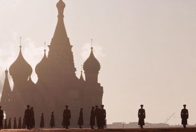 Soldiers stand in front of the cathedral of Basil the Blessed, during commemorations for the 50th anniversary of the October Revolution.