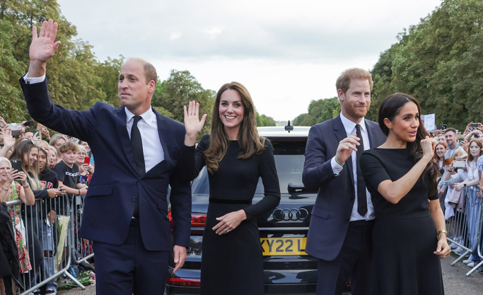 Catherine, Princess of Wales, Prince William, Prince of Wales, Prince Harry, Duke of Sussex, and Meghan, Duchess of Sussex wave to crowd on the long Walk at Windsor Castle on September 10, 2022, in Windsor, England. Crowds have gathered and tributes left at the gates of Windsor Castle to Queen Elizabeth II, who died at Balmoral Castle on 8 Sept. 2022. 