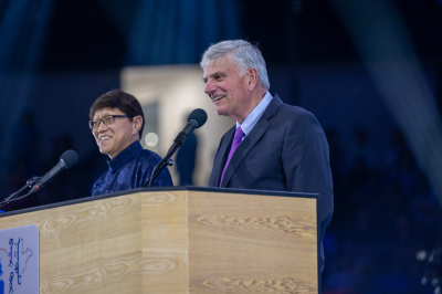 Franklin Graham (R), with the help of his Mongolian interpreter (L), speaks during the two-night Festival of Hope Billy Graham Evangelistic Association outreach event at Steppe Arena in Ulaanbataar, Mongolia, held September 2022.