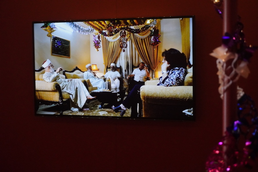 A short documentary film clip is shown at the Samaritan exhibit at the Museum of the Bible in Washington, D.C., on Sept. 15, 2022. Pictured is a still image of film showing members of the Samaritan people group sitting under a traditional Samaritan sukkah.