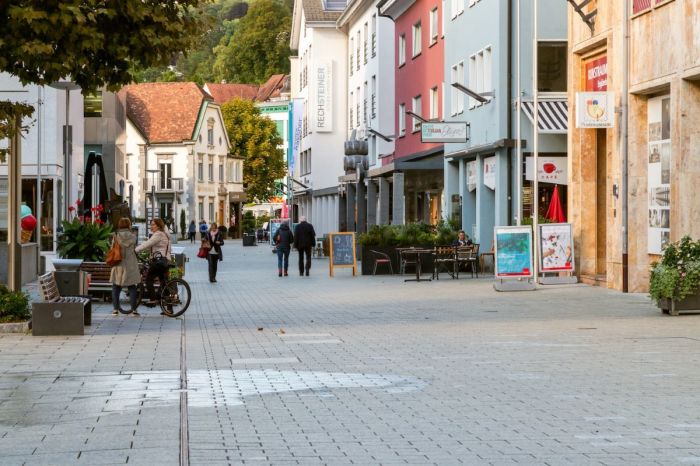 People walk on the pedestrian-only main street in Vaduz, Liechtenstein.