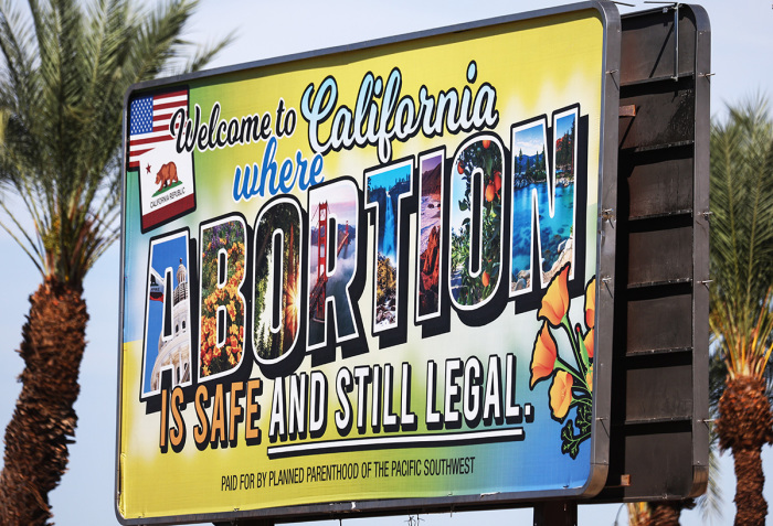 A billboard reads, 'Welcome to California where abortion is safe and still legal' on July 12, 2022, in Rancho Mirage, California. The billboard was paid for by Planned Parenthood of the Pacific Southwest. 