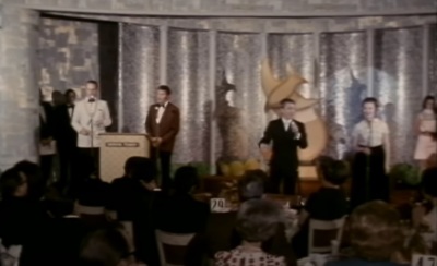 Attendees of the first-ever Gospel Music Association Dove Awards, held on Oct. 10, 1969, in Memphis, Tennessee, sing the Christian song 'Jesus is Coming Soon.' 