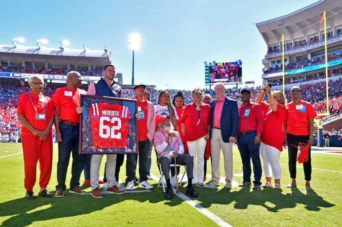 James Meredith receives a jersey during the first half of the game between the Mississippi Rebels and the Kentucky Wildcats at Vaught-Hemingway Stadium on October 01, 2022 in Oxford, Mississippi.