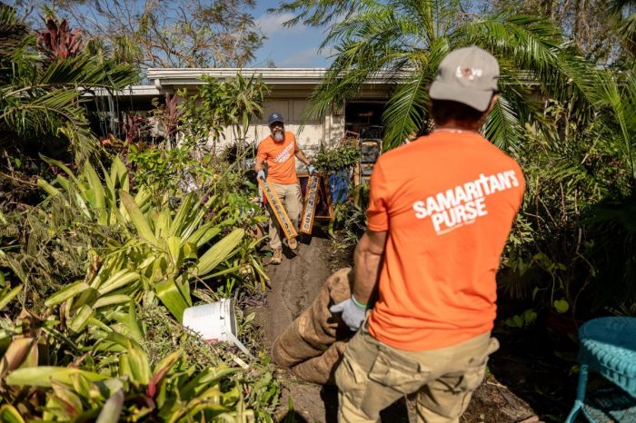 Volunteers with the charitable organization Samaritan's Purse clean out a southwest Florida home damaged by Hurricane Ian.