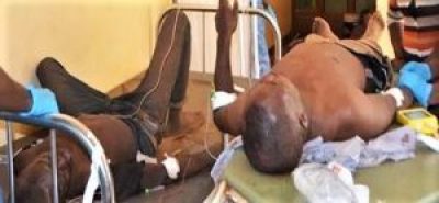 Andrew Dikusooka and Ronald Musasizi receive hospital treatment after being knifed in Iganga Disrict, Uganda. 