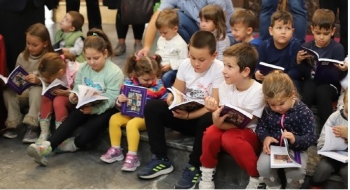 North Macedonian children read bibles delivered by EEM in 2022. 