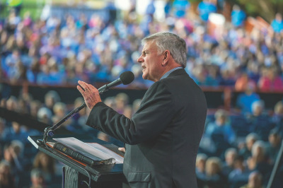 Franklin Graham preaches to a crowd of roughly 13,200 people at the Mediolanum Forum on Saturday, Oct. 29, 2022, for the Noi Festival in Milan, Italy.  