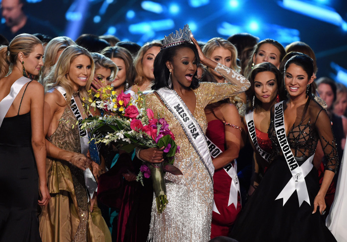 Miss District of Columbia USA 2016 Deshauna Barber (C) is surrounded by fellow contestants after she was crowned the new Miss USA during the 2016 Miss USA pageant at T-Mobile Arena on June 5, 2016, in Las Vegas, Nevada. 