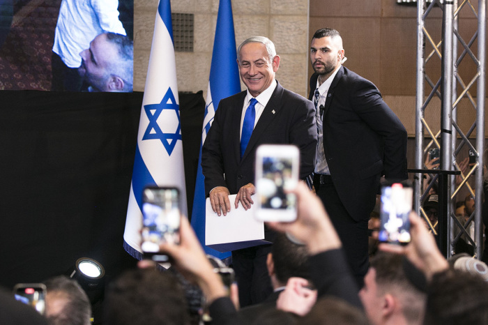 Prime Minister and Likud party leader Benjamin Netanyahu smiles as he enters an election night event for the Likud party on November 1, 2022, in Jerusalem, Israel. 