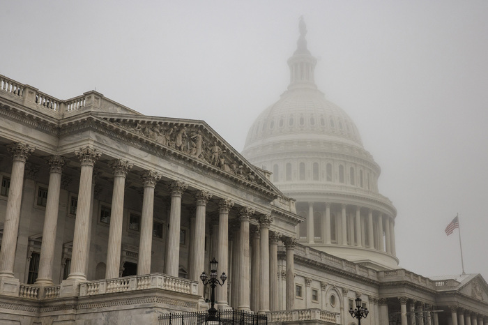 Early morning fog envelopes the U.S. Capitol dome behind the U.S. House of Representatives on Nov. 4, 2022, in Washington, D.C. Republicans are poised to regain control of the U.S. Congress in the midterm elections on Nov. 8 after the Democrats gained the majority in both the House in 2018 and Senate in 2020. 
