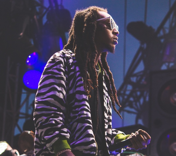 Rapper Takeoff sings with the group Migos during a performance in October 2017. https://www.flickr.com/photos/thecomeupshow/35831104173/in/photostream/