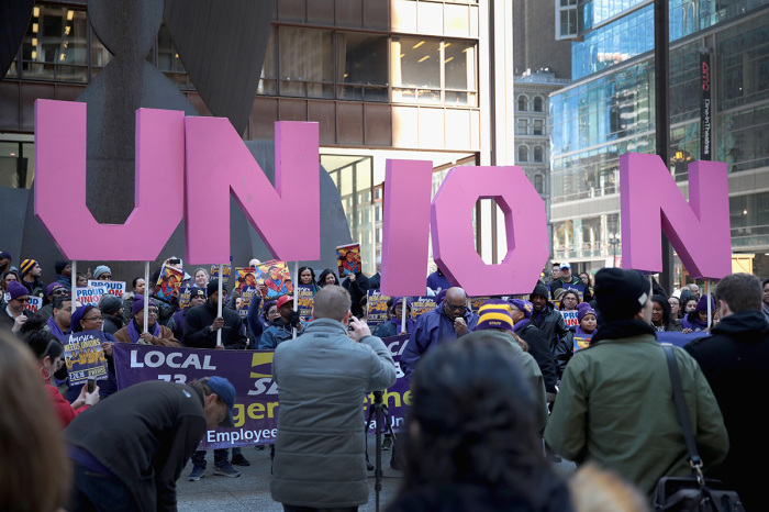 Members of the Service Employees International Union (SEIU) hold a rally in support of the American Federation of State County and Municipal Employees (AFSCME) union at the Richard J. Daley Center plaza on Feb. 26, 2018, in Chicago, Illinois. 