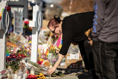 Mourners at a memorial outside of Club Q on Nov. 22, 2022, in Colorado Springs, Colorado. A gunman opened fire inside the LGBT club on Nov. 19, killing five and injuring 25 others. (Photo by Chet Strange/Getty Images)
