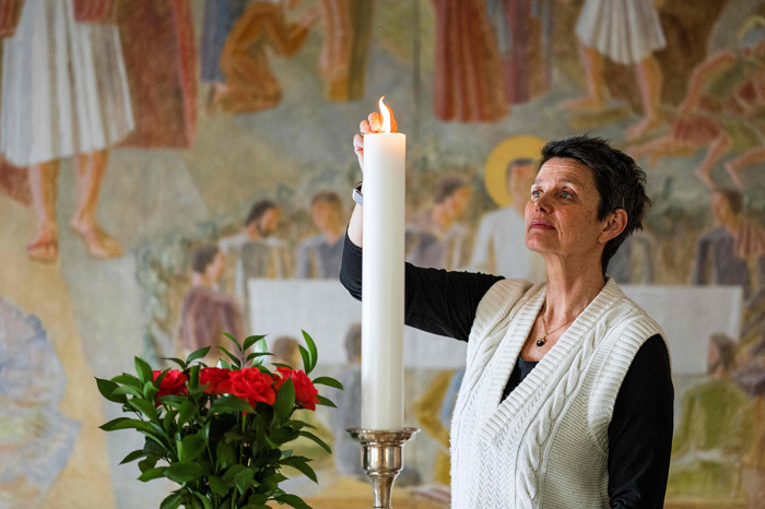 Pastor Siv Limstrand lights a candle at the church in Svalbard, in Longyearbyen, Spitsbergen island, Svalbard Archipelago, northern Norway, on May 6, 2022. 
