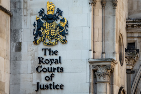Facade of the Royal Courts of Justice along the Strand in the City of Westminster in London, England.