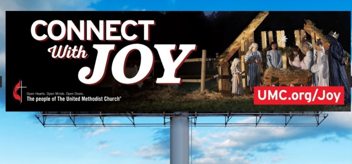 A billboard displays The United Methodist Church's 2022 'Connect With Joy' Christmas season advertisement.