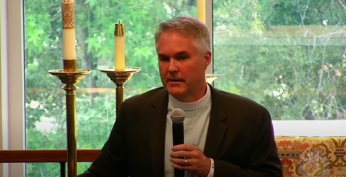 The Rev. Charlie Holt, a priest in the Episcopal Diocese of Florida, giving remarks in at an event held in May 2022. 