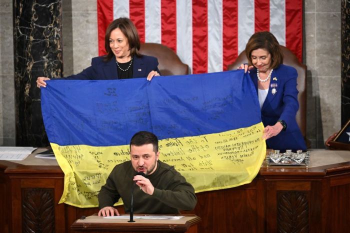 Ukraine's President Volodymyr Zelensky speaks after giving a Ukrainian national flag to U.S. House Speaker Nancy Pelosi, D-Calif., and Vice President Kamala Harris during his address the U.S. Congress at the US Capitol in Washington, D.C. on December 21, 2022.(Photo by Mandel NGAN / AFP) (Photo by MANDEL NGAN/AFP via Getty Images) 